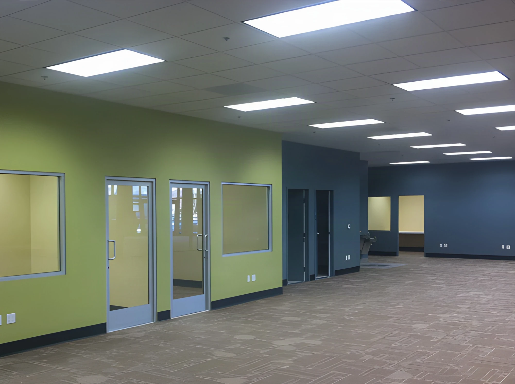 Glass-doored private offices along a green wall at the Puente Hills Army Career Center