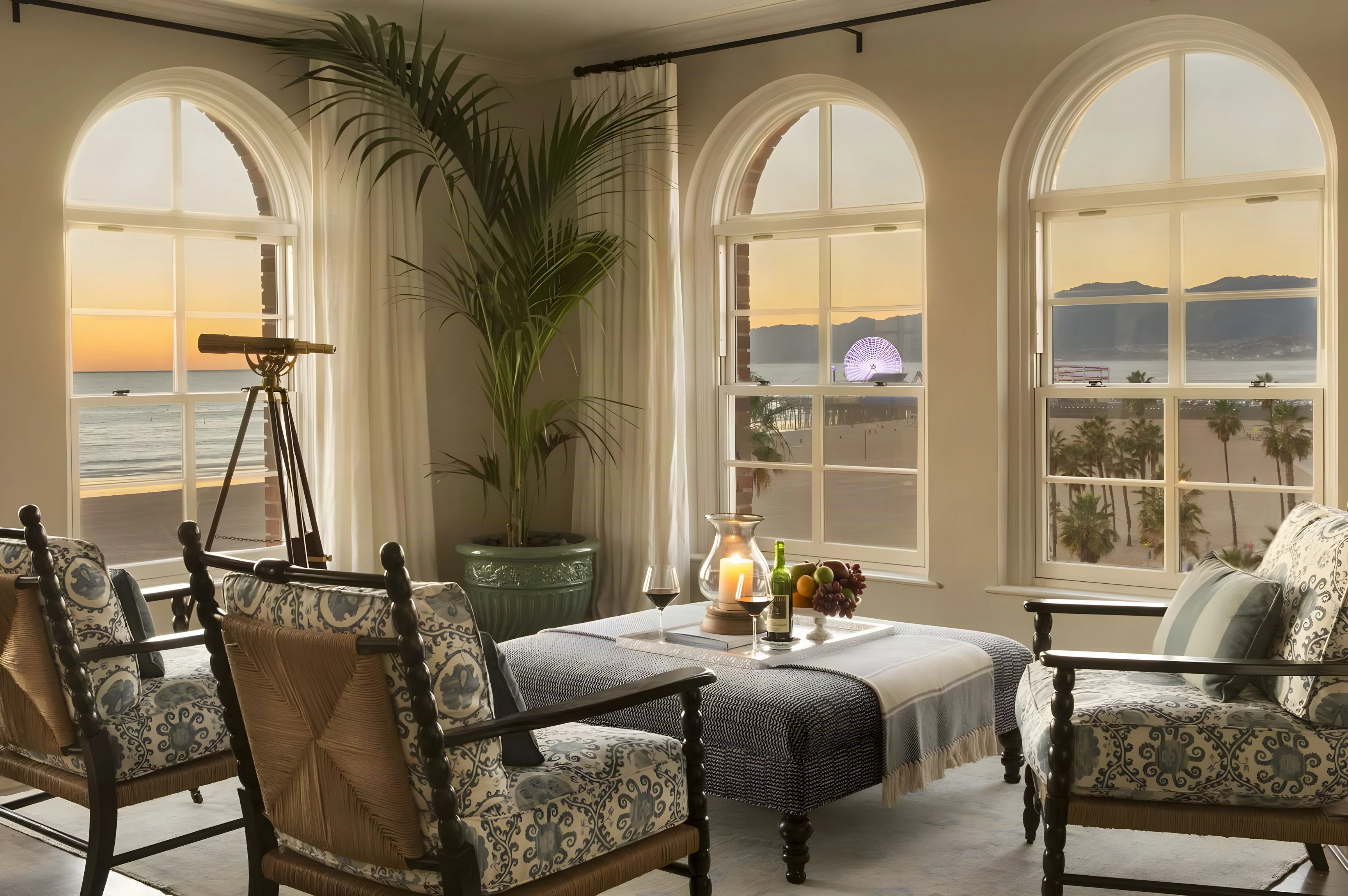 Casa del Mar sitting room at sunset with arched windows and the Santa Monica Pier wheel