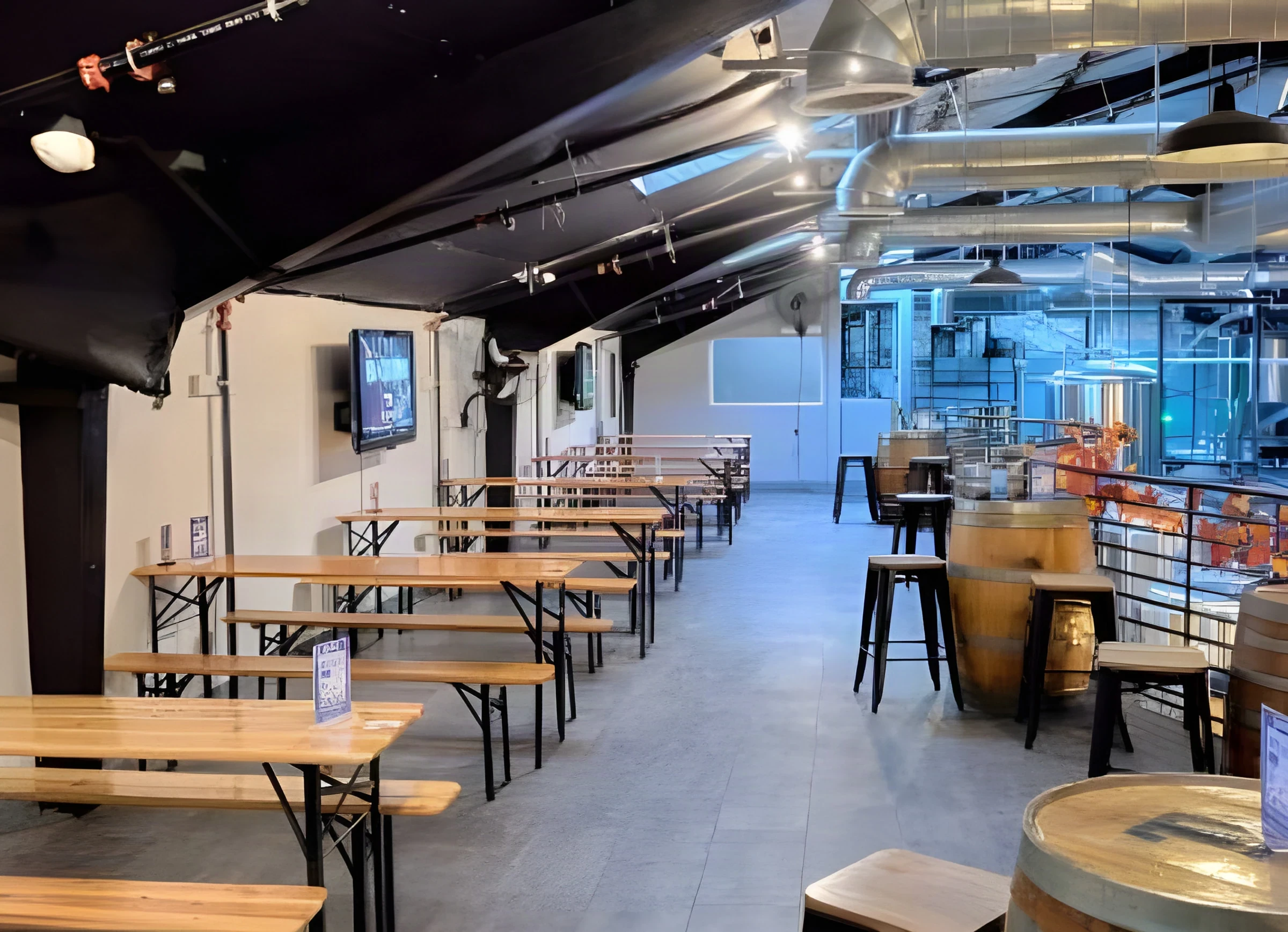 Upper-level seating at Lawless Brewing Co. with beer-hall tables, barrel tops and bar stools