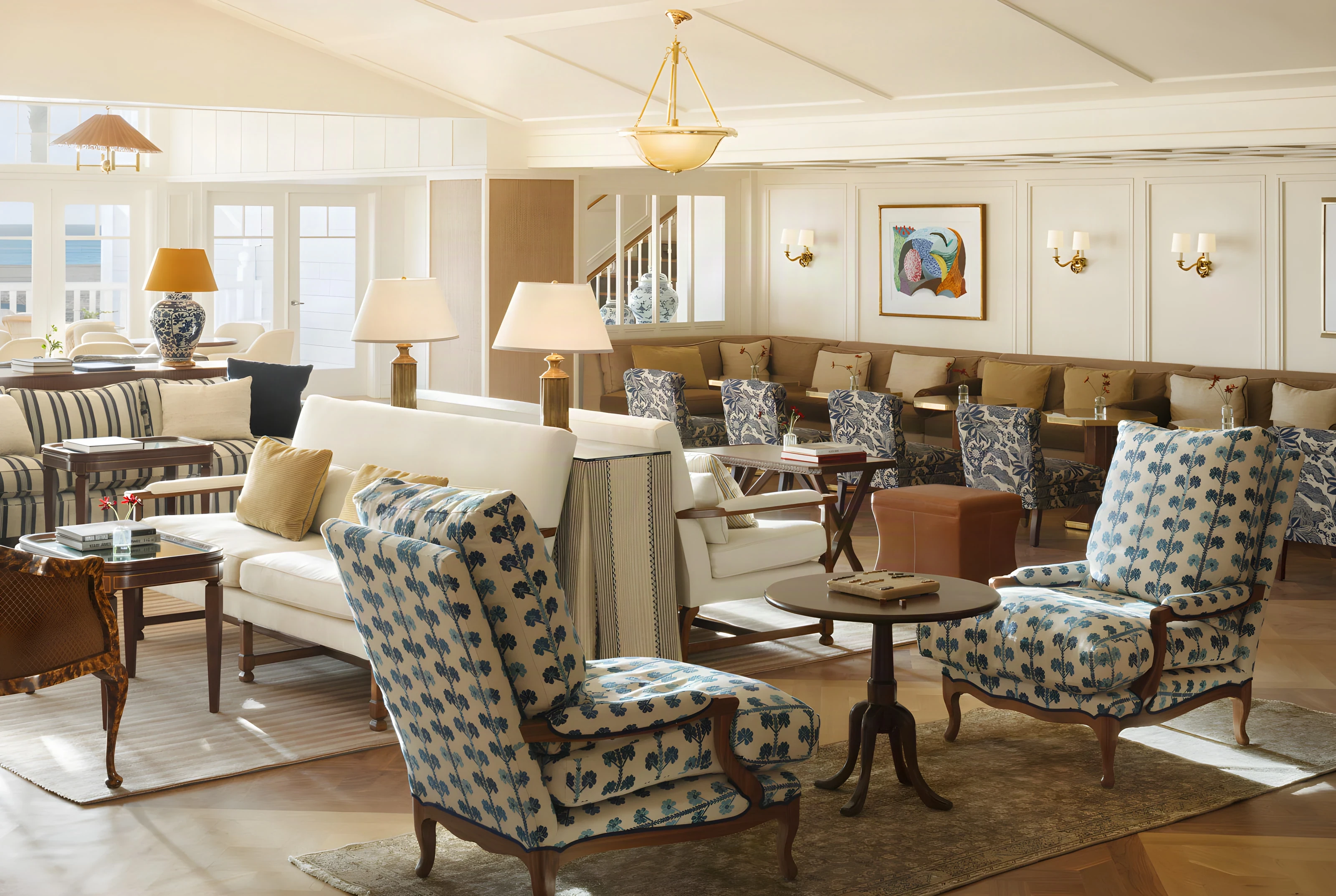 Shutters lobby lounge with patterned wingback chairs and a long banquette